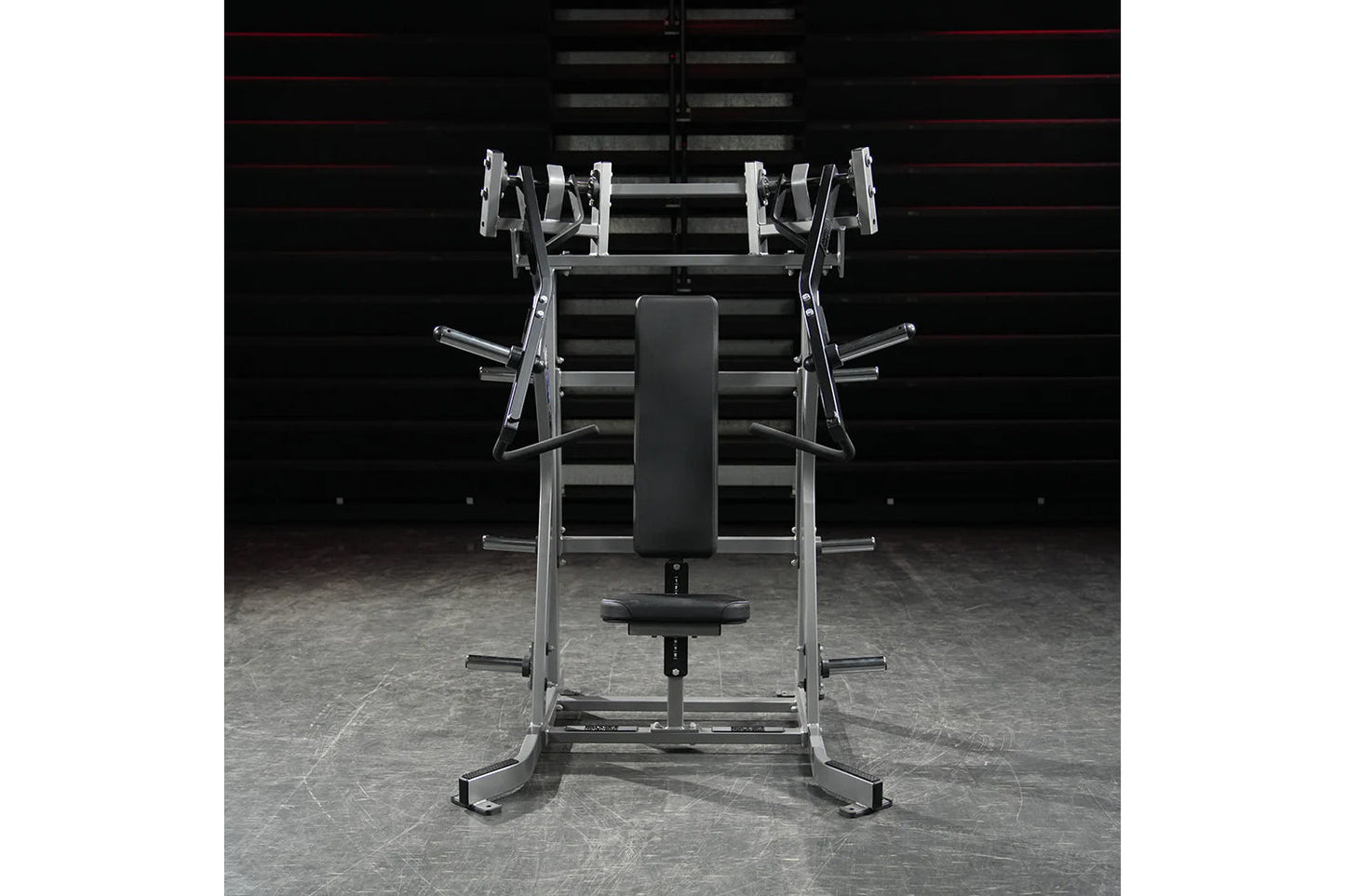 Hammer Strength plate-loaded iso-lateral incline press with chrome and silver frame, black padded seat and backrest, on concr