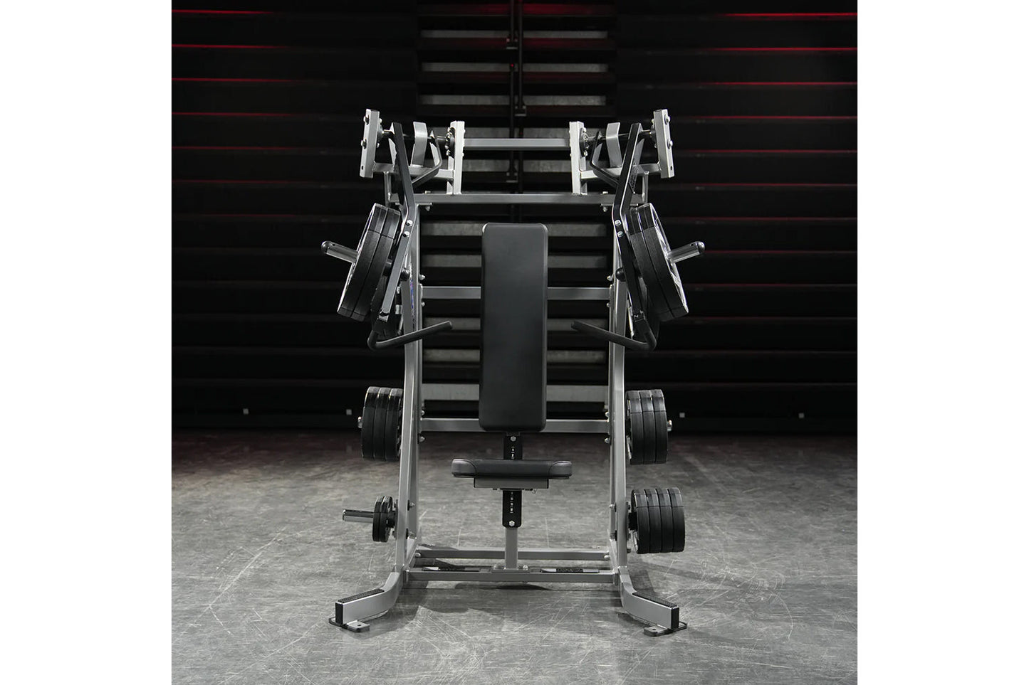 Hammer Strength plate-loaded iso-lateral incline press with silver frame, black padded seat and handles, loaded weight plates