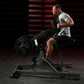 Man in gray shirt using black plate-loaded iso lateral row machine in gym setting with red stairs background