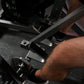 Person using black plate-loaded iso lateral row machine with metal frame and handles