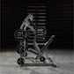 Hammer Strength plate-loaded iso-lateral shoulder press machine with black weight plates and gray frame in gym setting