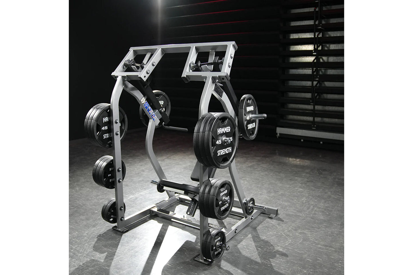 Hammer Strength Iso-Lateral Shoulder Press with silver frame, black weight plates labeled 45 lbs, dual handles and digital di