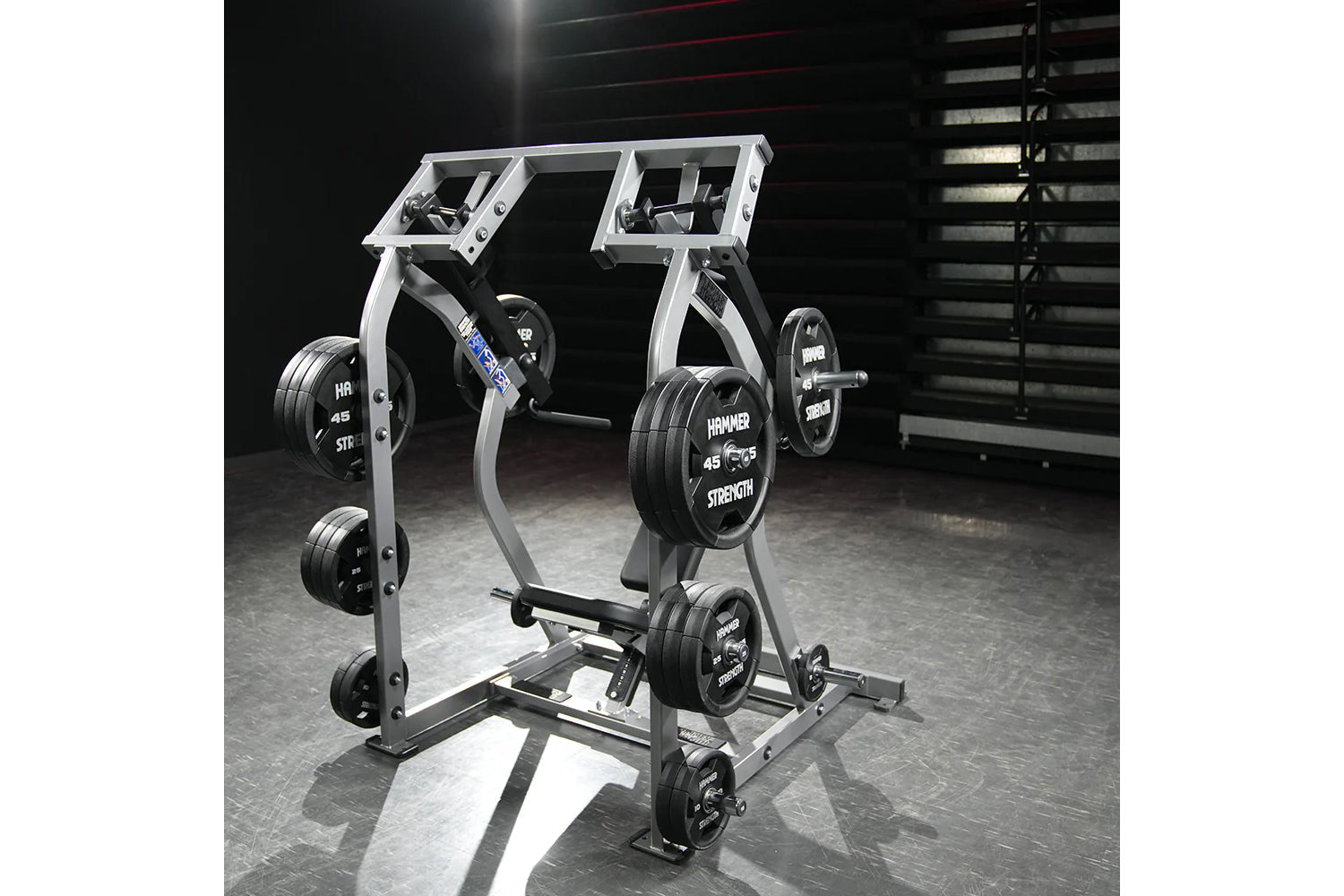 Hammer Strength Iso-Lateral Shoulder Press with silver frame, black weight plates labeled 45 lbs, dual handles and digital di