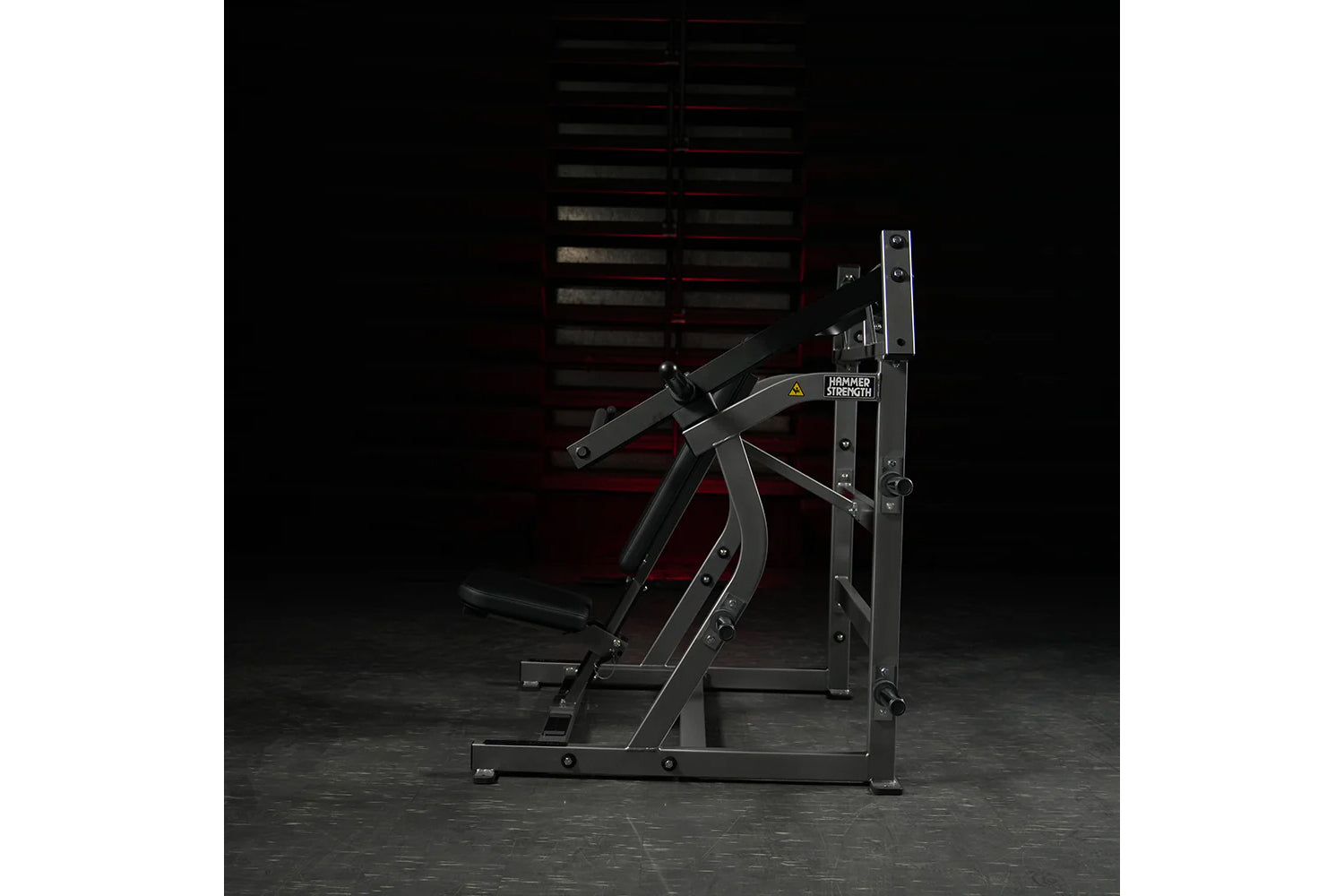 Hammer Strength plate-loaded iso-lateral super incline press with black frame and dual handles on dark background