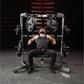 Bearded man in black tank top and pants performing chest press on Hammer Strength plate-loaded machine with loaded barbells i