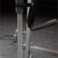 Hammer Strength plate-loaded chest press machine with gray frame and black handles in gym setting