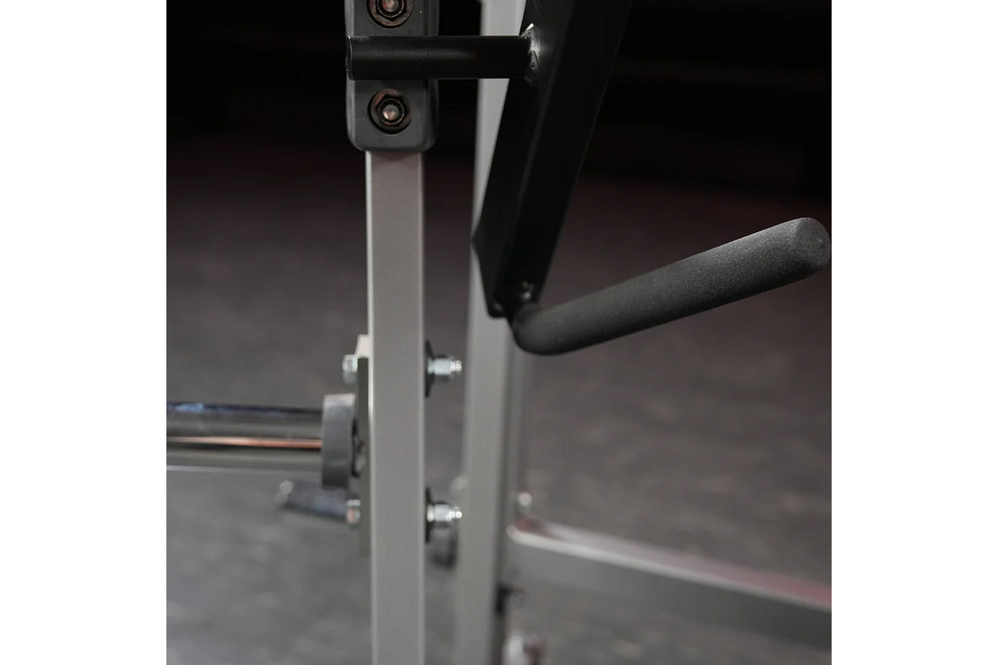Hammer Strength plate-loaded chest press machine with gray frame and black handles in gym setting