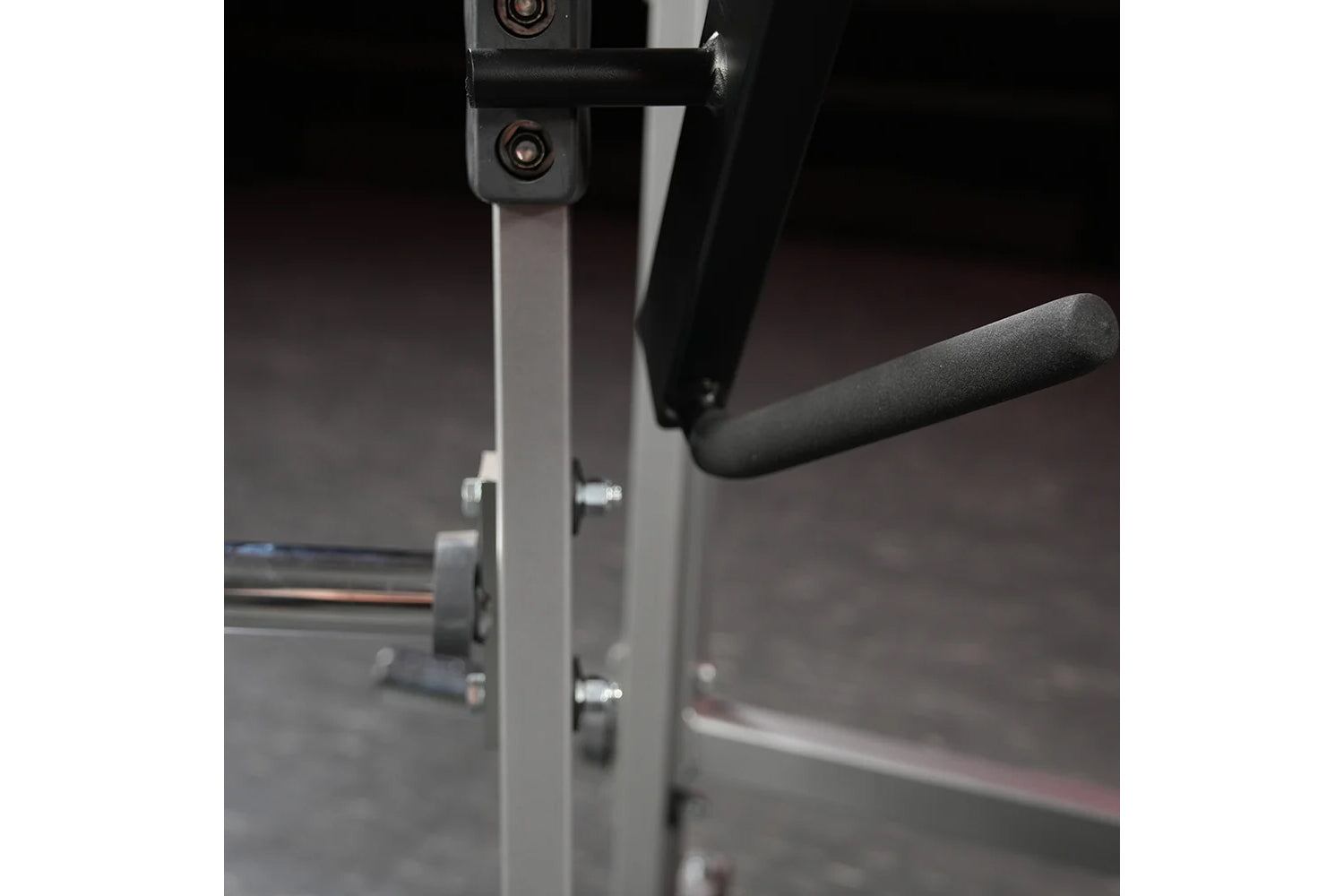 Hammer Strength plate-loaded chest press machine with gray frame and black handles in gym setting