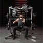 Man performing chest press on Hammer Strength plate-loaded machine with black weight plates in gym setting