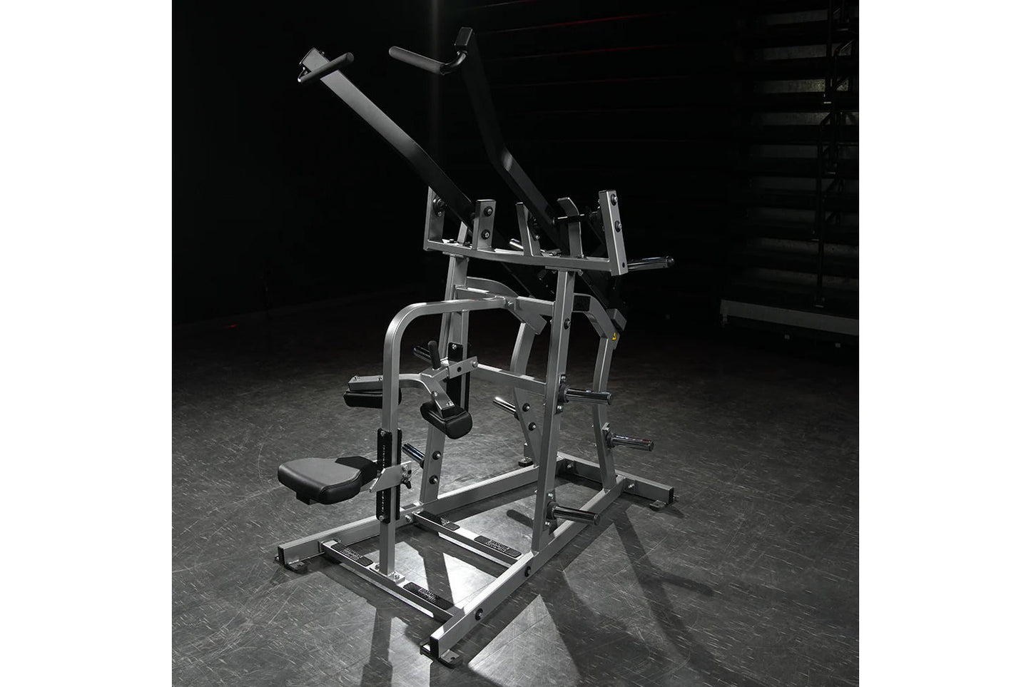Hammer Strength plate-loaded iso-lateral wide pulldown machine with dual handles, metal frame, and padded seat in gym setting