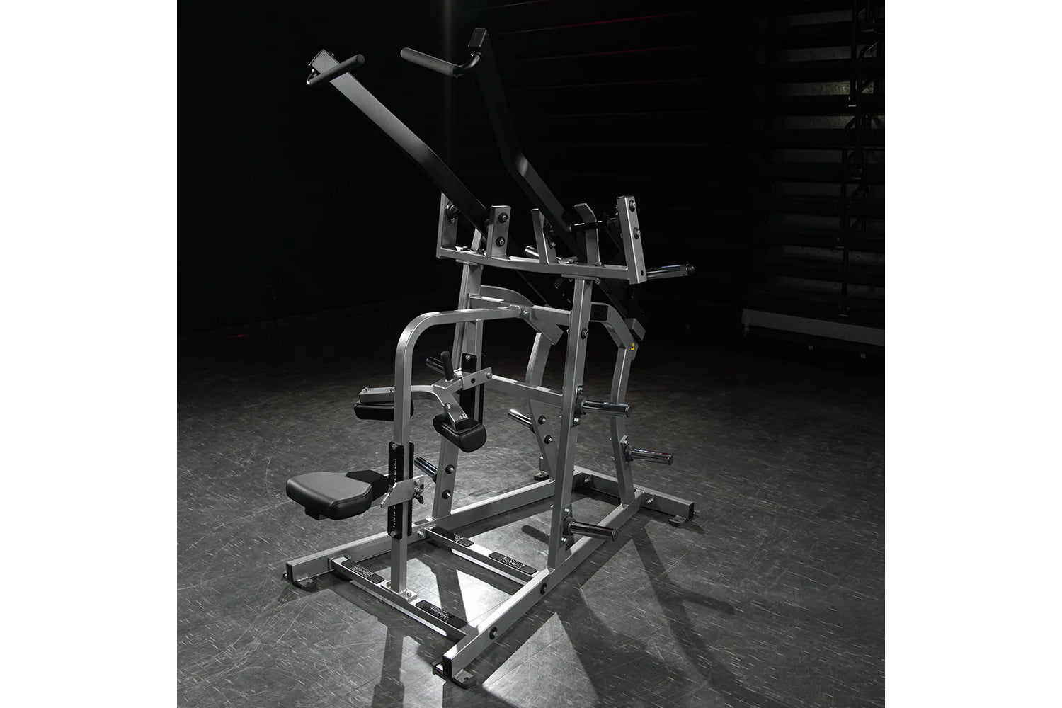Hammer Strength plate-loaded iso-lateral wide pulldown machine with dual handles, metal frame, and padded seat in gym setting