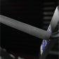 Gray fabric seat and armrest detail of Hammer Strength plate-loaded iso-lateral wide pulldown machine, close-up view