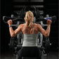 Woman lifting weight on hammer strength plate-loaded iso-lateral wide pulldown machine in gym setting
