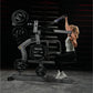 Woman using black Hammer Strength plate-loaded iso-lateral wide pulldown machine with weight plates in gym setting