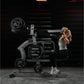 Woman using black Hammer Strength plate-loaded iso-lateral wide pulldown machine with weight plates in gym setting