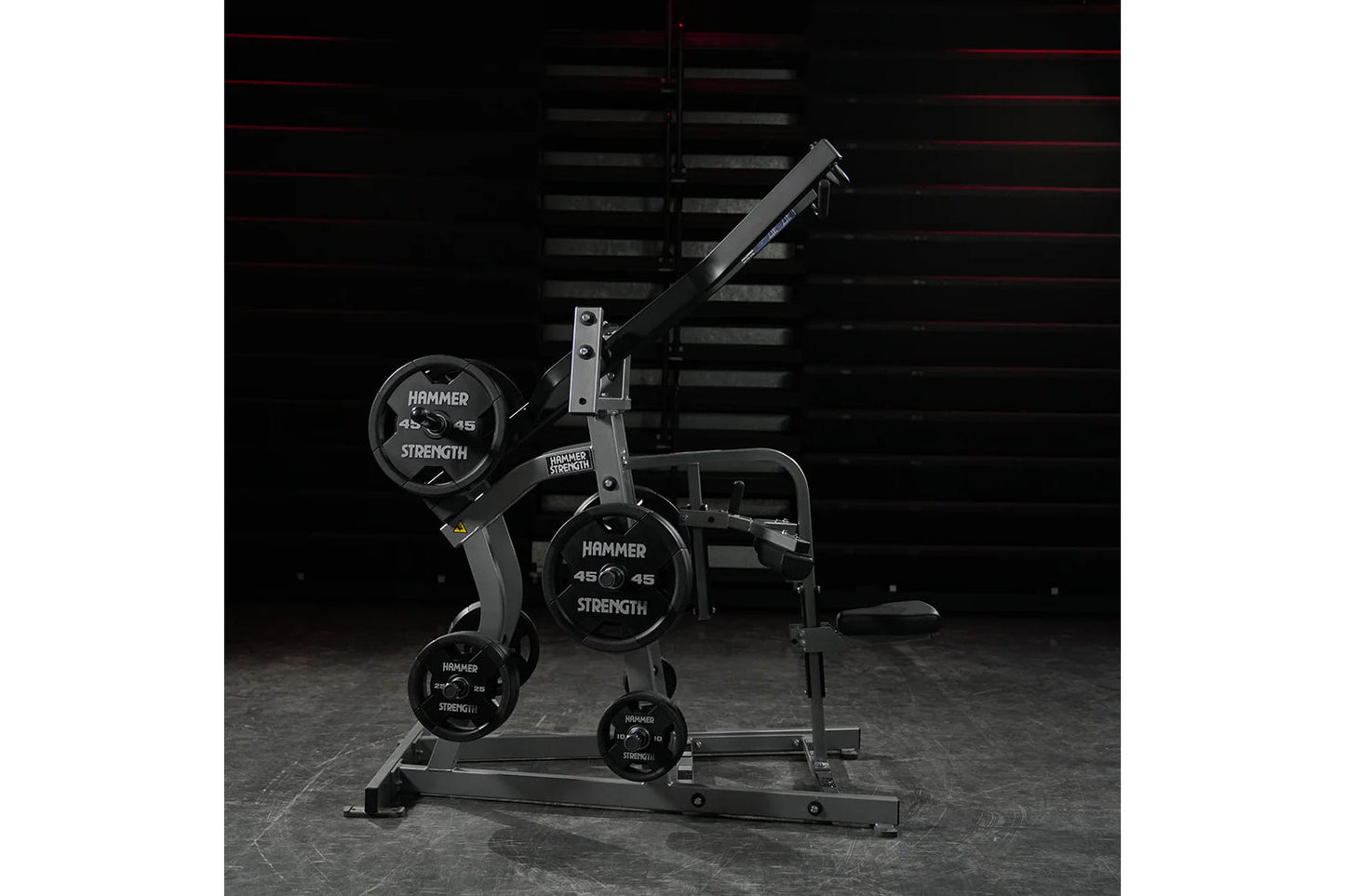 Hammer Strength black plate-loaded iso-lateral wide pulldown machine with labeled weight plates, on concrete floor