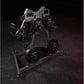 Hammer Strength plate-loaded lateral raise machine with gray frame and black weight plates on dark background