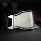 Silver metal belt buckle with "LIFT" text engraved on face, chrome hardware, on dark background