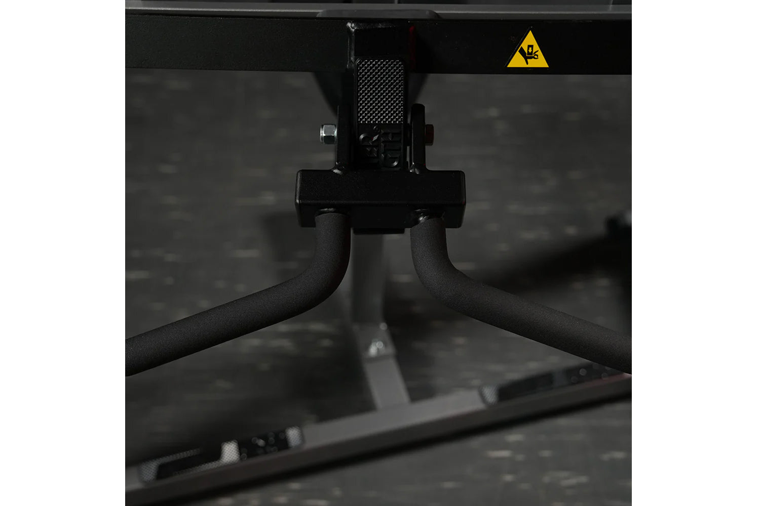 Black plate-loaded seated biceps machine with curved handles and metal frame, front view