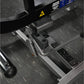 Hammer Strength plate-loaded seated calf raise machine with black frame, gray footplate, and dual foot pedals on gym floor