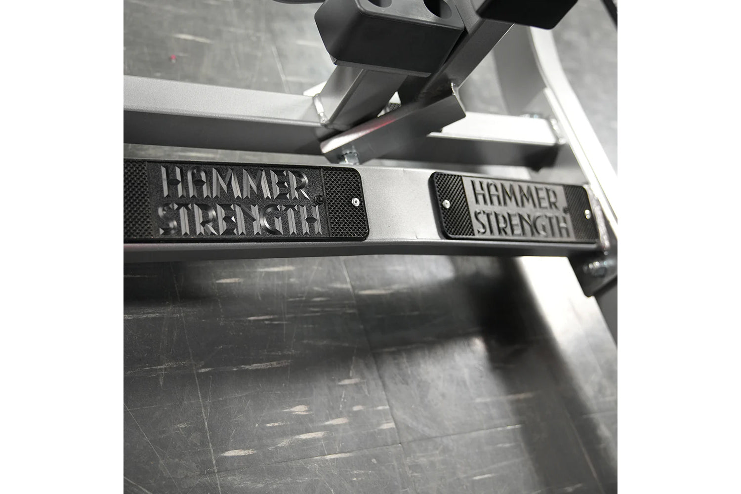 Hammer Strength plate-loaded seated calf raise machine with black and silver frame detail showing branded footplate
