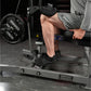Man using Hammer Strength plate-loaded seated calf raise machine with black padding and weight plates