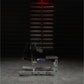 Hammer Strength plate-loaded seated calf raise machine with black seat and gray metal frame, displayed in gym setting