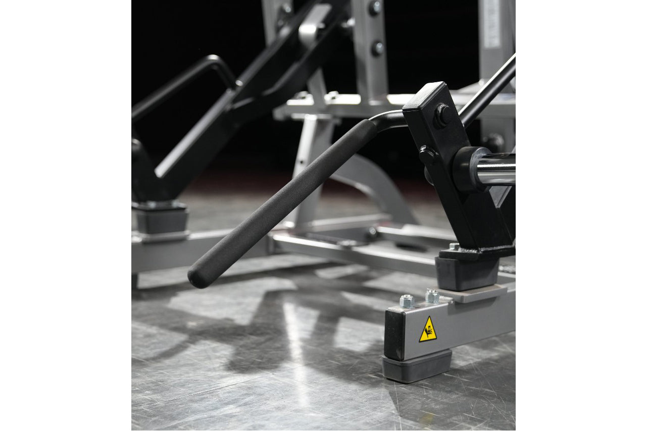 Hammer Strength plate-loaded squat high pull machine with black handles and metal frame on gray floor