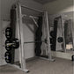 Hammer Strength Smith Machine with silver frame, black weight plates, and horizontal barbell in gym setting