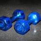 Pair of blue translucent hexagonal dumbbells with Jelly-Bell branding, displayed on dark textured surface