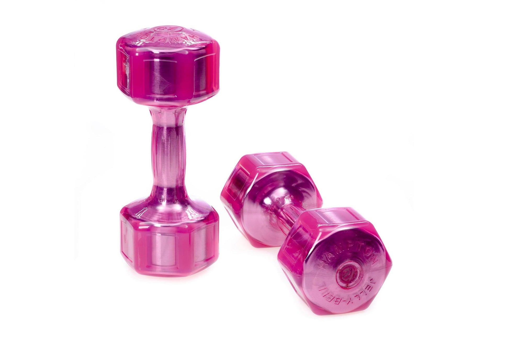 Hampton Jelly-Bell urethane aerobic dumbbells in bright pink, shown as one standing dumbbell and two hexagonal weights on whi