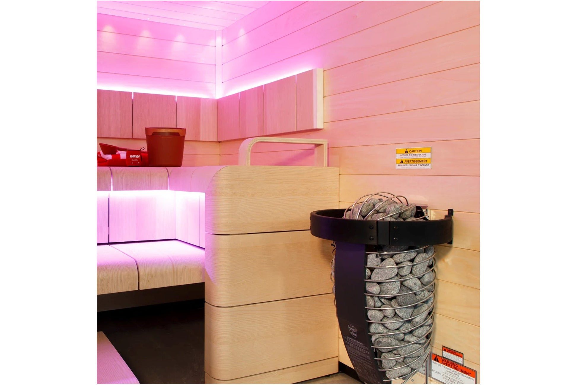 Harvia Spirit electric sauna heater with rocks in cedar-lined sauna room with pink neon lighting