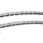 Two-tier horizontal dumbbell rack with silver aluminum frame, black rubber saddle holders, and sturdy support legs on white b