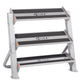 White and gray metal dumbbell rack with three horizontal shelves and black anti-slip surfaces, featuring Hoist branding and o