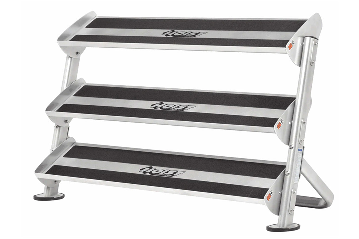 Hoist 60-inch dumbbell rack with three tiers, silver aluminum frame and black rubber-lined shelves, on white background