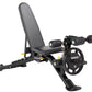 Black and yellow Hoist 7-position FID weight bench with adjustable backrest, leg extension attachment, and weight plate stora