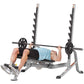 Hoist 7-Position Olympic Bench Press with dual black weight pegs, gray frame, and black upholstered bench, demonstrated by ma
