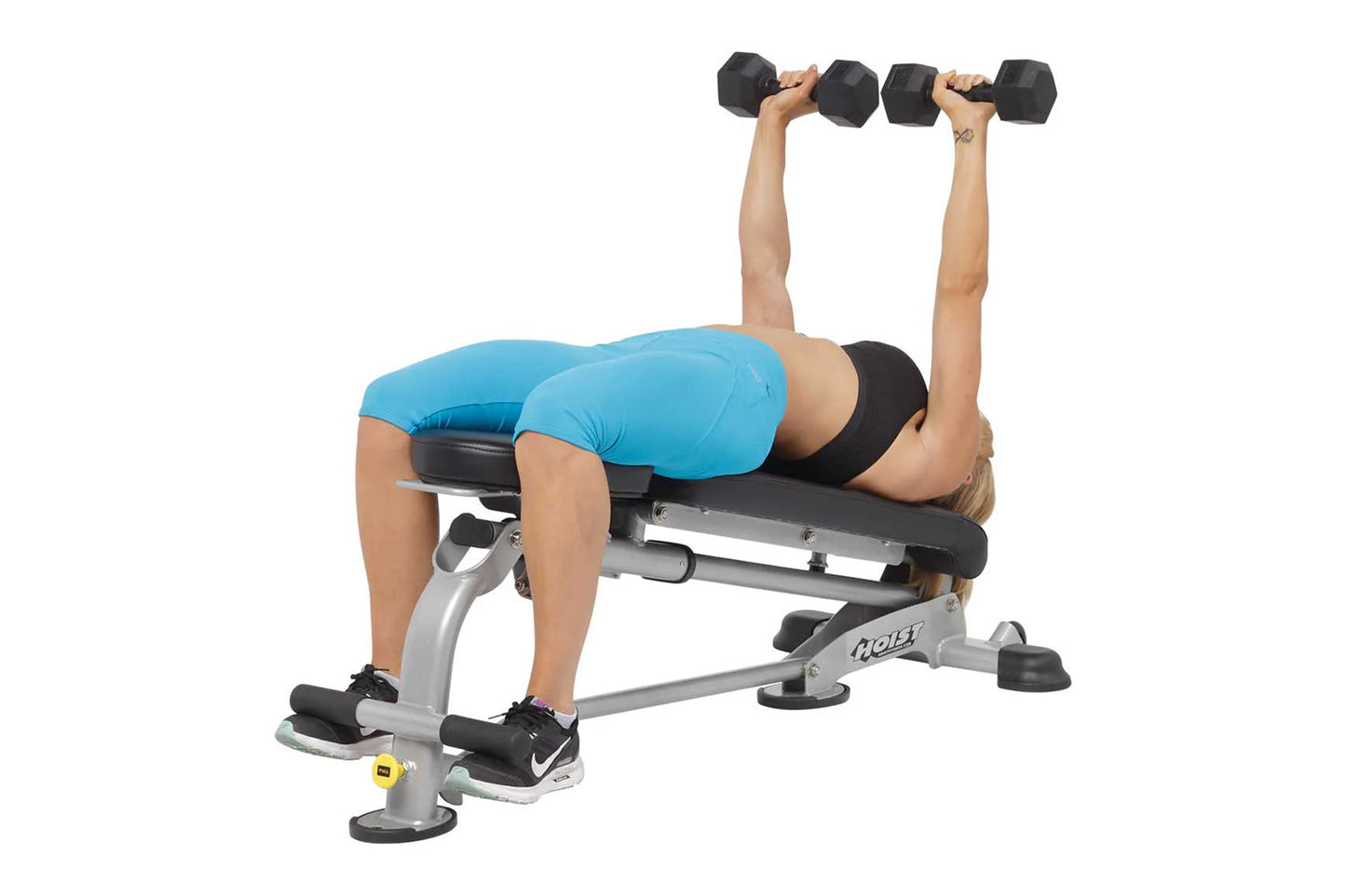 Person in blue shirt performing dumbbell chest press on Hoist silver and black weight bench with adjustable backrest