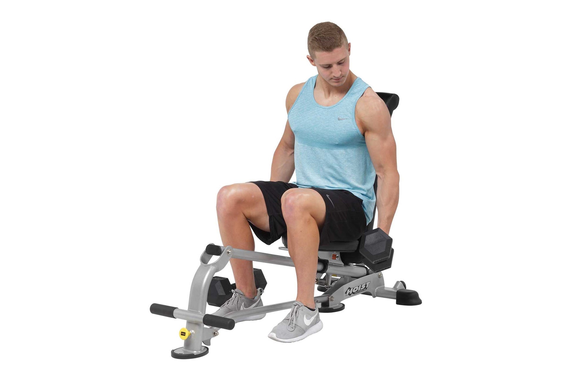 Male model wearing light blue tank top and black shorts using silver and black weight bench with adjustable seat and leg exte