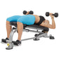 Person demonstrating dumbbell chest press on gray and black Hoist adjustable weight bench with foot platform
