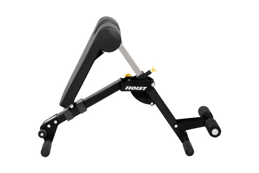 Black and gray Hoist ab/back hyper bench with padded seat, adjustable backrest, and foot platform on white background