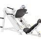 White leg press machine with black padded seat and backrest, angled frame design, on white background