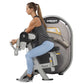 Woman using Hoist Biceps Curl machine, gray and black equipment with digital display, worn by model in gray tank top and ligh