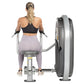 Woman using Hoist Mid Row machine, viewed from behind, wearing black sports bra and lavender leggings