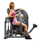 Woman using black and gray Hoist Chest Press machine with yellow accents, wearing pink sports bra and shorts on white backgro