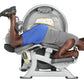 Man using Hoist standing prone leg curl machine with gray frame, blue padded seat, and yellow accents