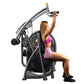 Hoist Club Line Shoulder Press machine with gray and black frame, woman in pink sports bra and shorts using equipment on whit
