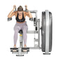 Woman performing abdominal exercise on Hoist Club Line leg press machine with silver frame and black seat, wearing black spor