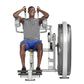 Man using gray and white Hoist Club Line abdominal machine, wearing gray t-shirt and blue shorts, demonstrating seated ab exe