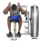Man using gray and silver Hoist abdominal machine with blue shorts and gray tank top, front view against white background